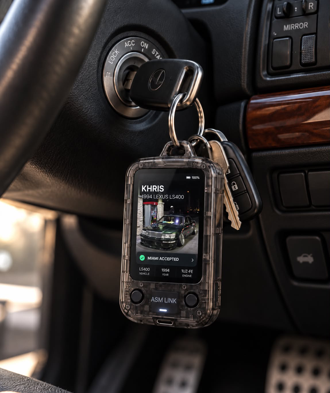 ASM LINK keychain concept render hanging from a Lexus ignition