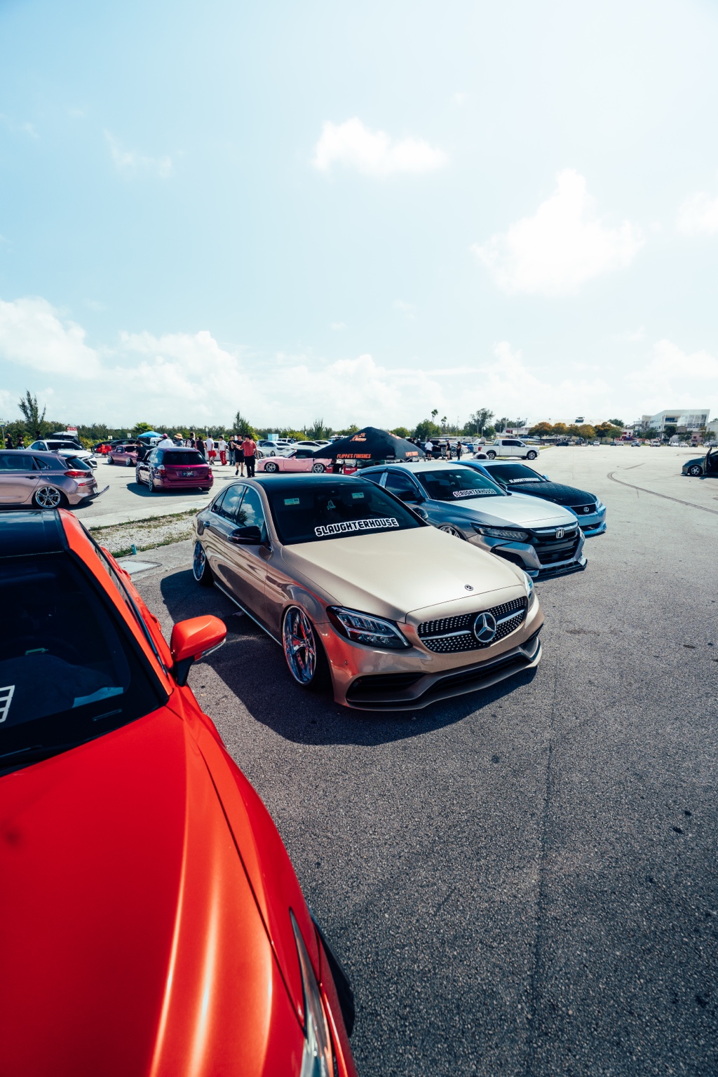 A lineup of modified cars at an ASM event